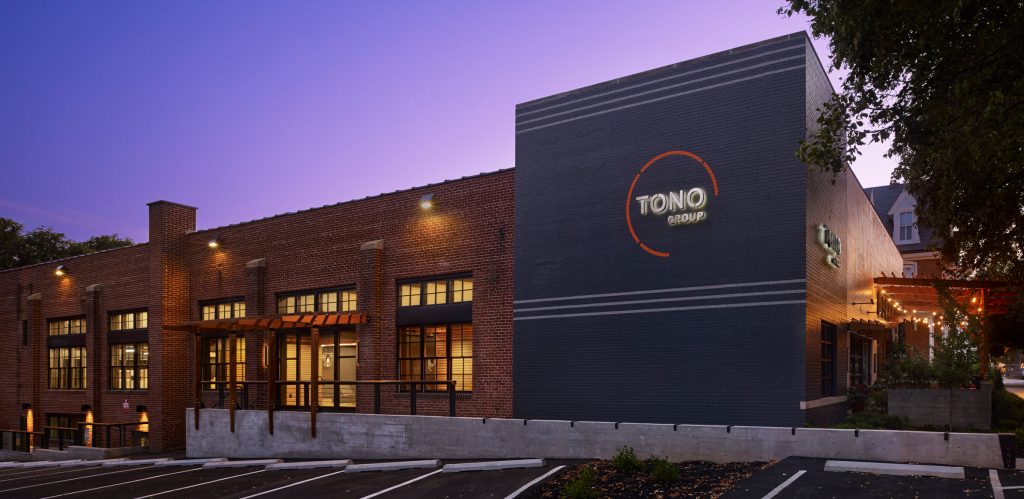 TONO Group office exterior at night